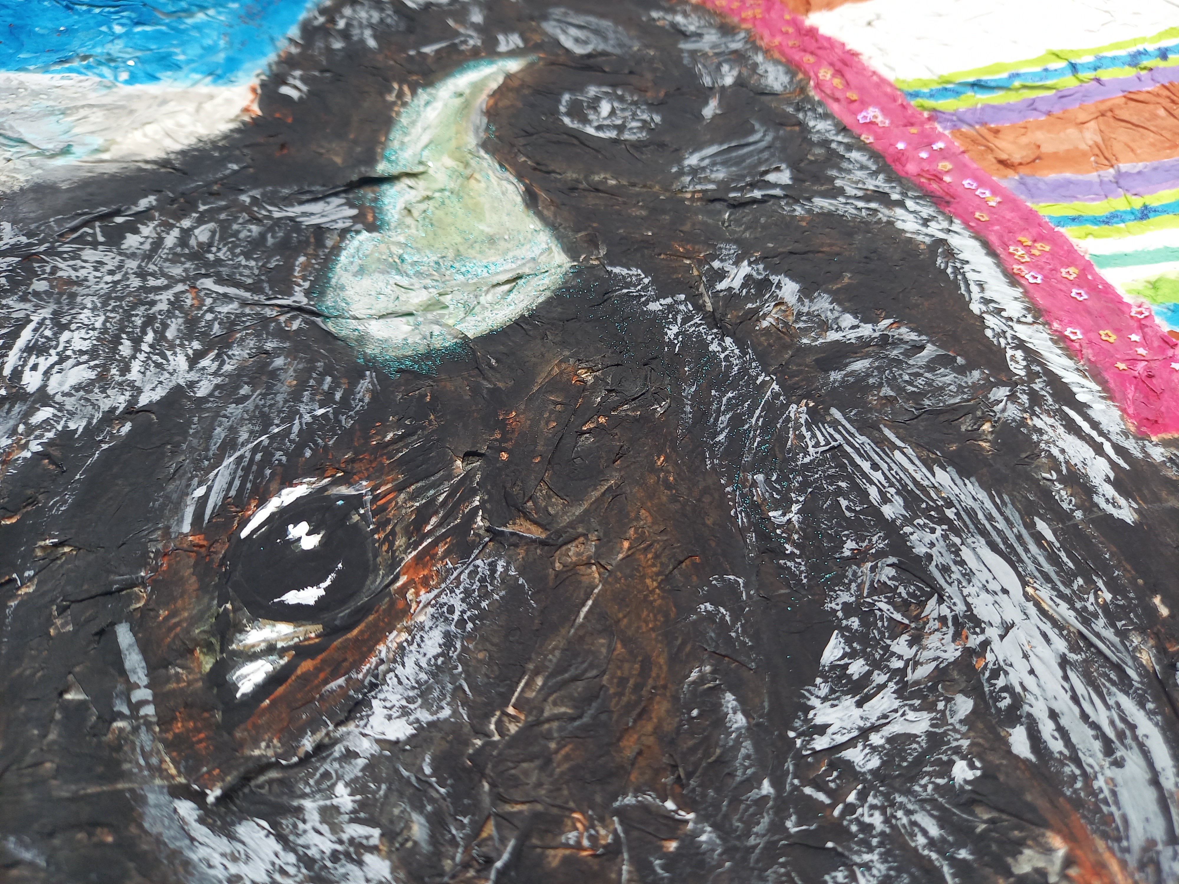 A painting with paper mache as canvas